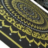 An oversized bandana printed with  gold and silver shimmer ink.